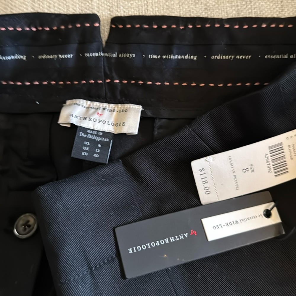 The essential wide leg black pant by Anthropologie.  Detailed back buckle